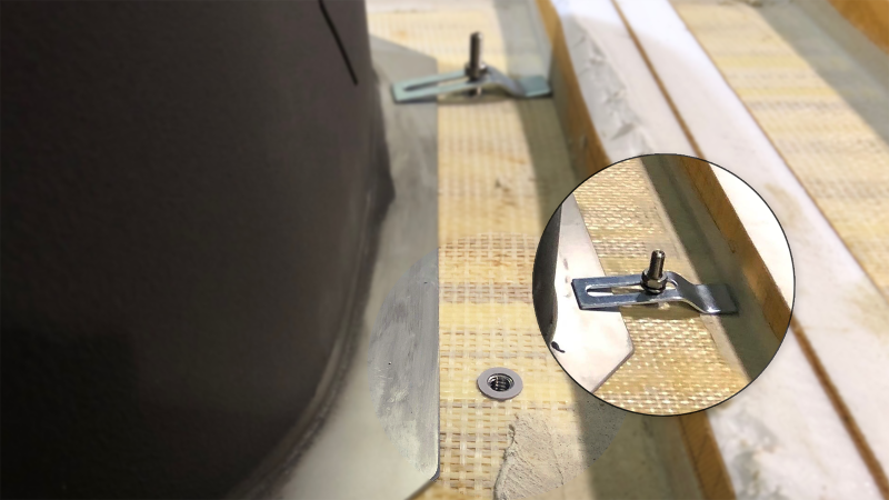 Close-up of a Keep-Nut threaded insert and sink clip installed in a countertop