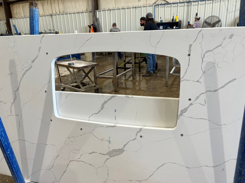 Keep-Nut anchors installed around a large undermount sink cutout in a fabrication shop