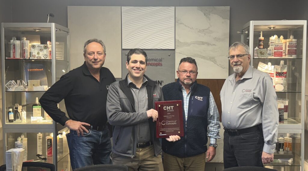 Chemical Concepts and CHT Group pose with award