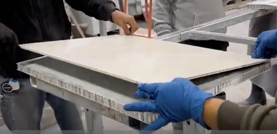 Laminating large format tile to honeycomb panel backer board
