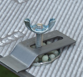 Glue-on sink anchor bonded to countertop with Z-shaped clip, washer, and wingnut tightened