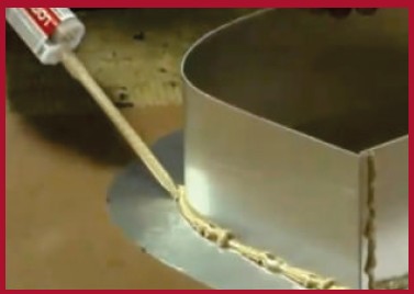 Applying LORD Signlok 406 structural adhesive along a reverse channel letter seam